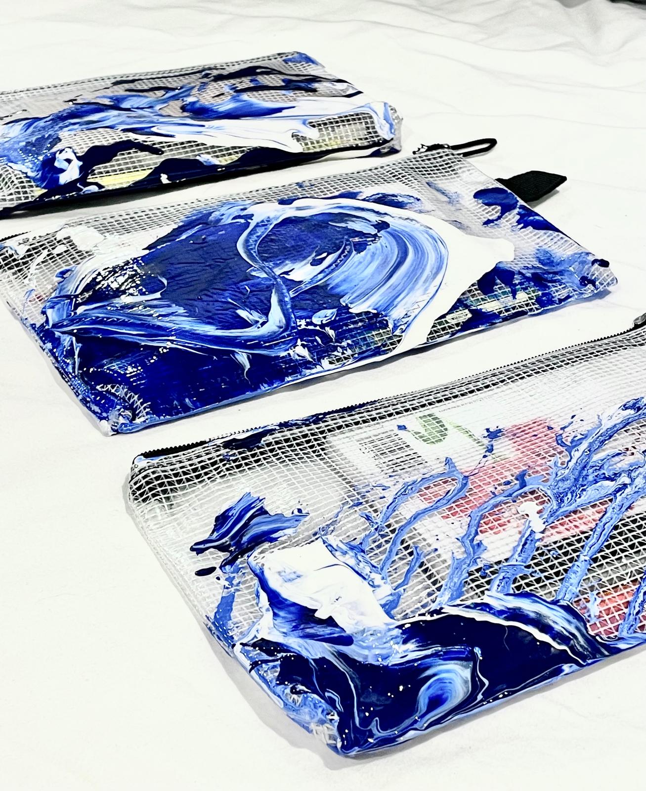 Clear pouches hand-painted in cobalt and white