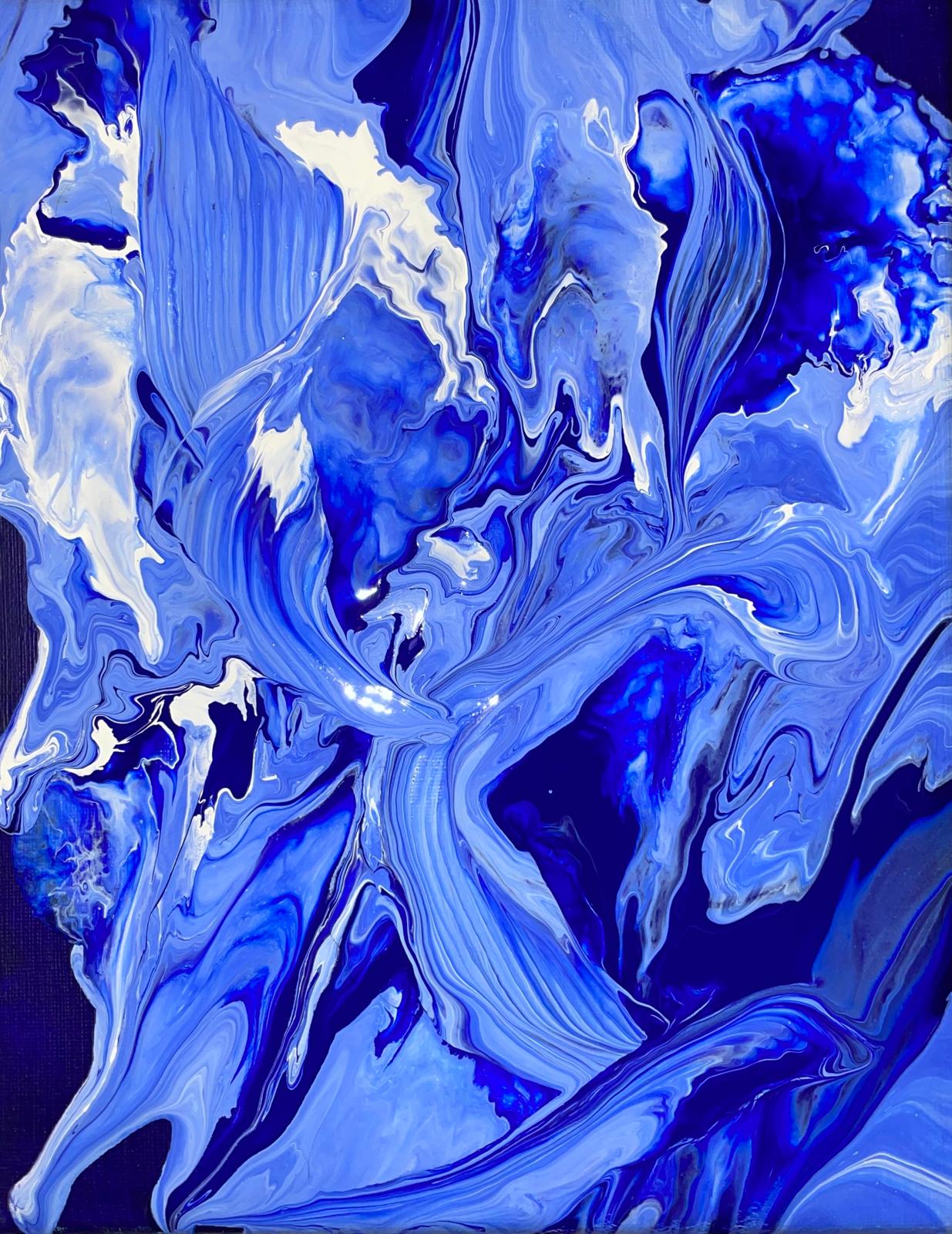 Close view of poured, marbled blue paint