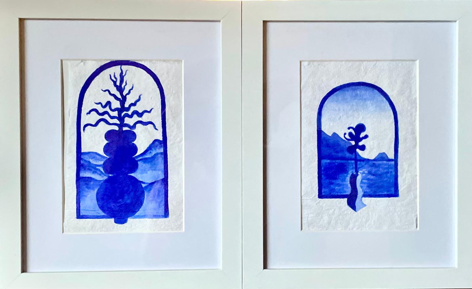 Pair of framed arched paintings with blue trees and hills
