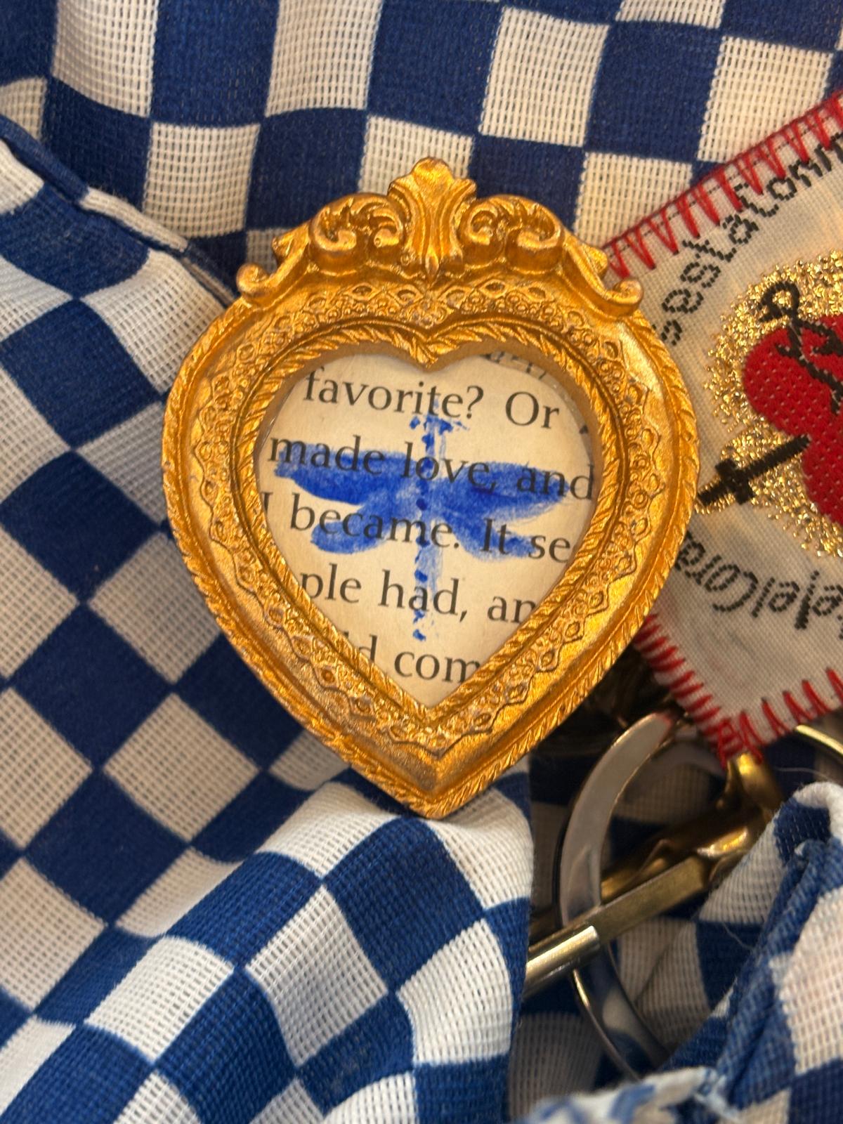 Gold heart frame with a painted dragonfly on blue gingham