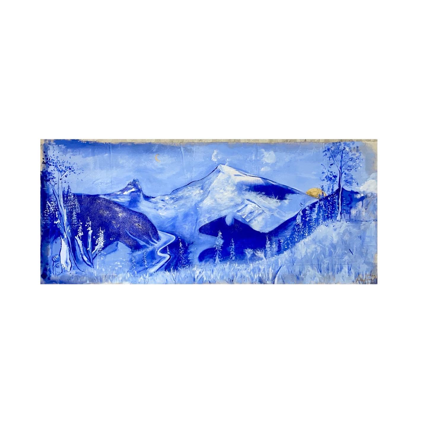 Panoramic blue mountain landscape with a small gold sun