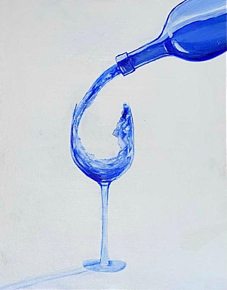 Blue liquid pouring into a wine glass