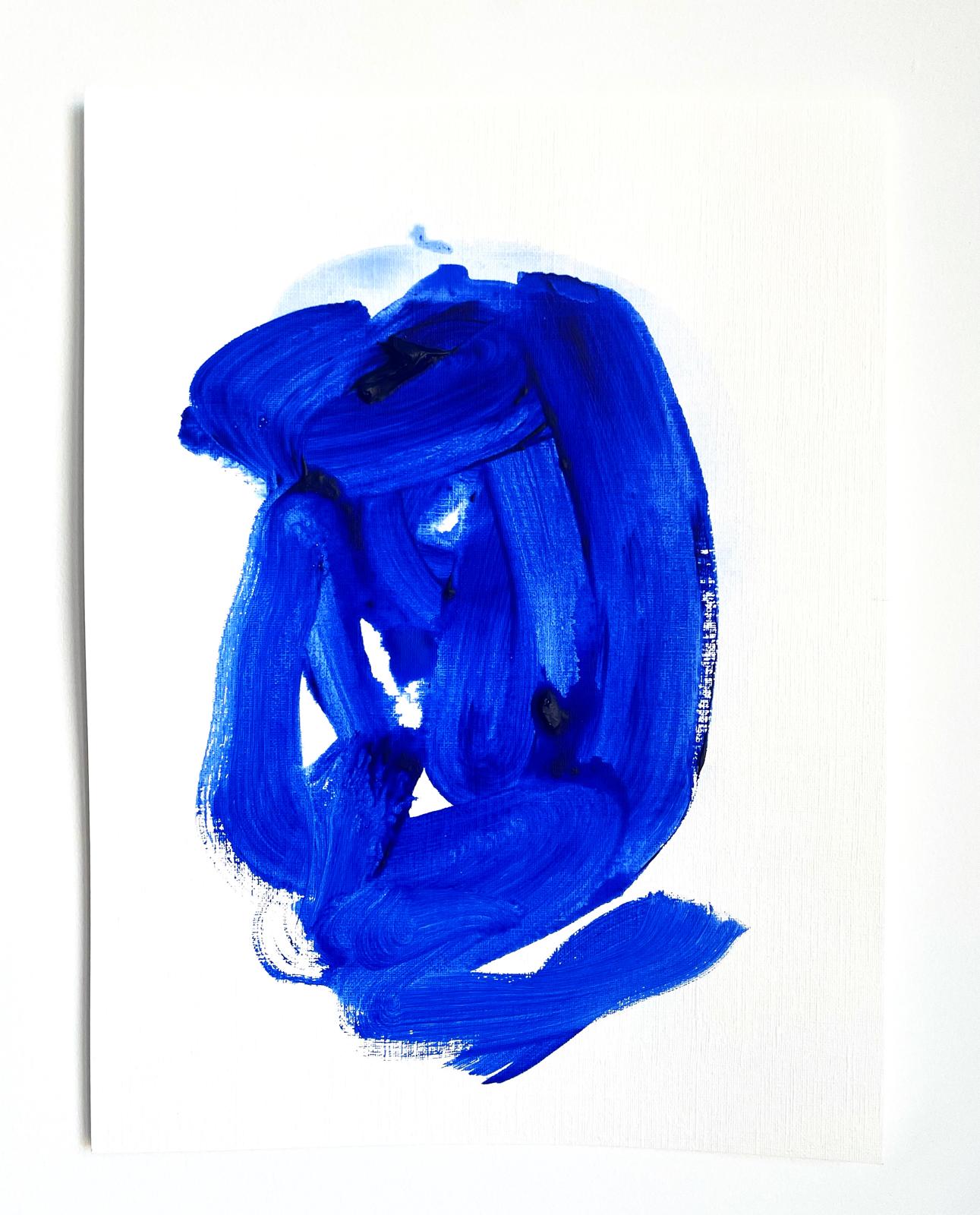 Bold cobalt brush gesture on white paper