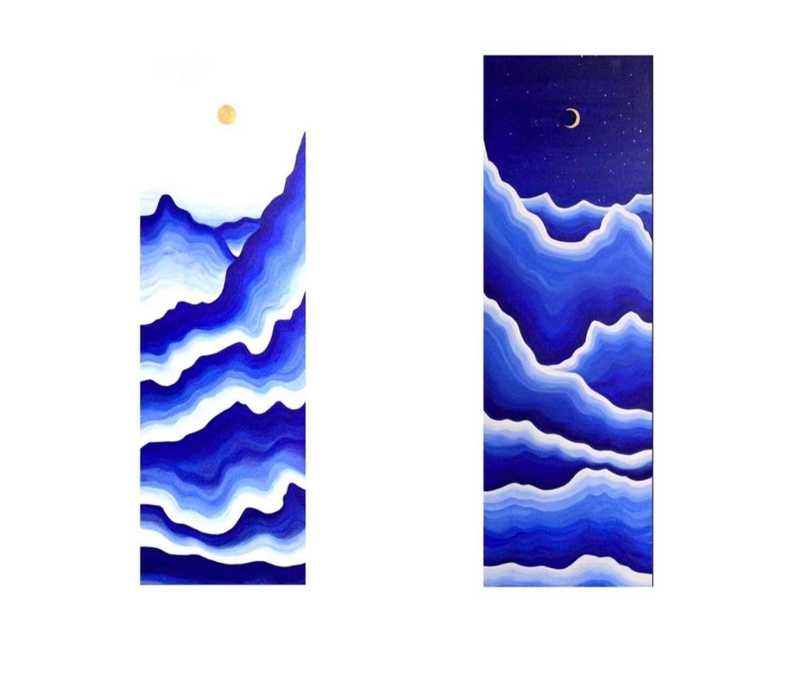 Pair of tall wave paintings under a sun and a crescent moon